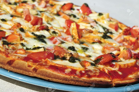 3408768-Freshly-baked-mediterranean-pizza-served-on-a-plate-Stock-Photo